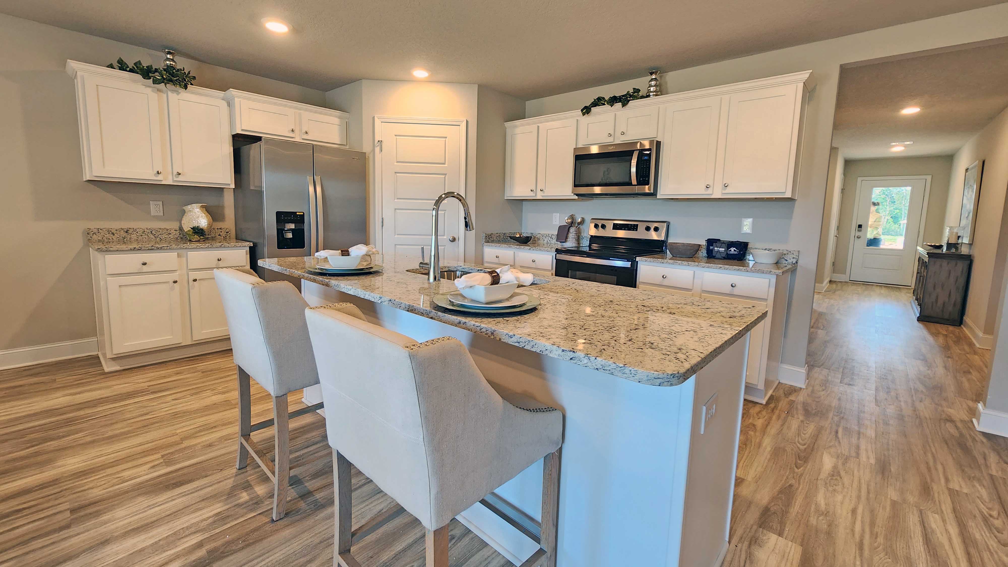 Beautiful kitchen with white shaker cabinets.