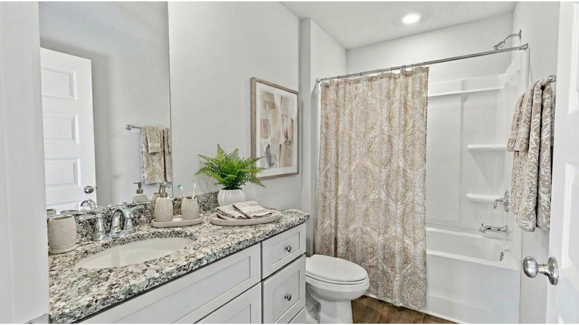 Guest bath with neutral decor in the Aldridge.