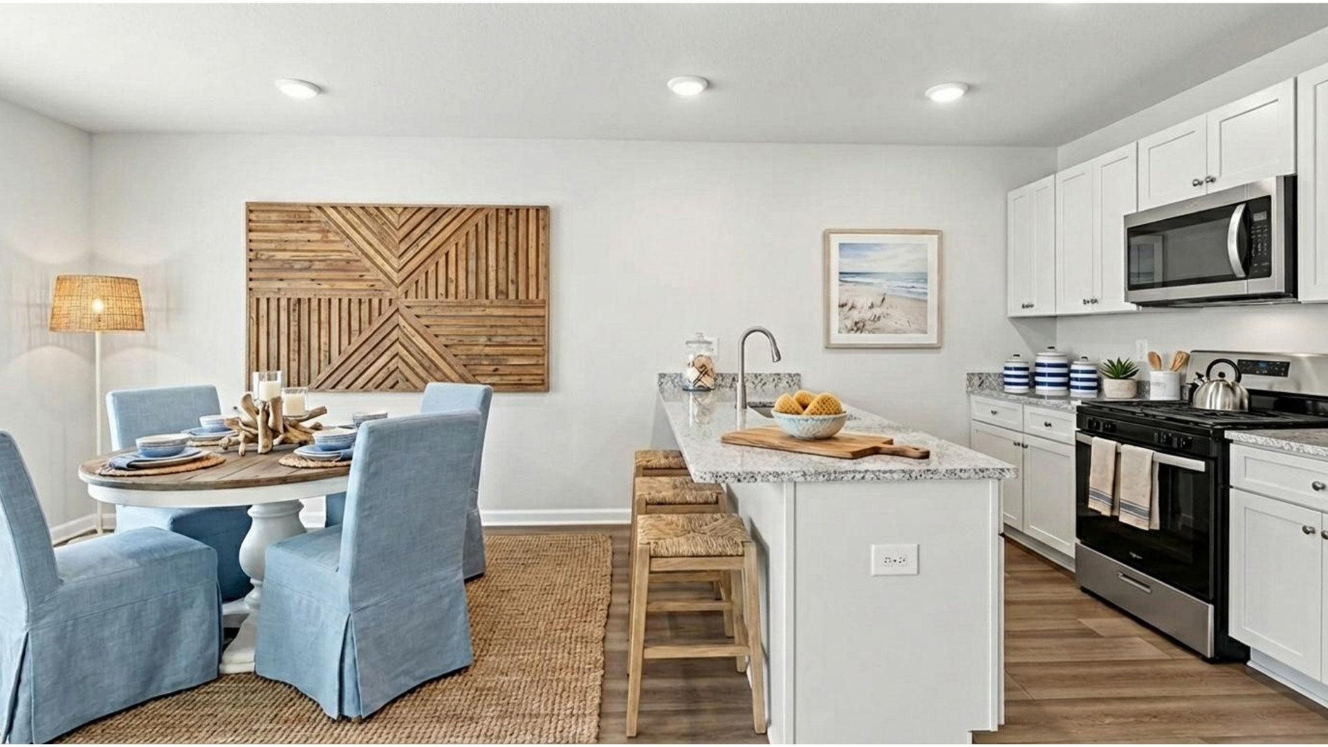 Kitchen and dining room with coastal design.