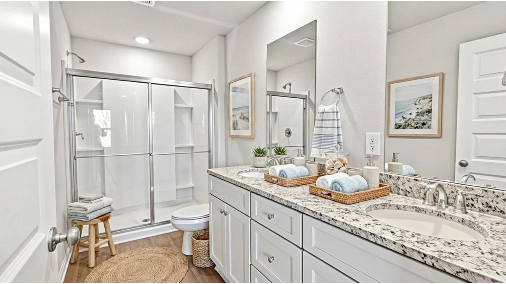 Primary bath with coastal decor.