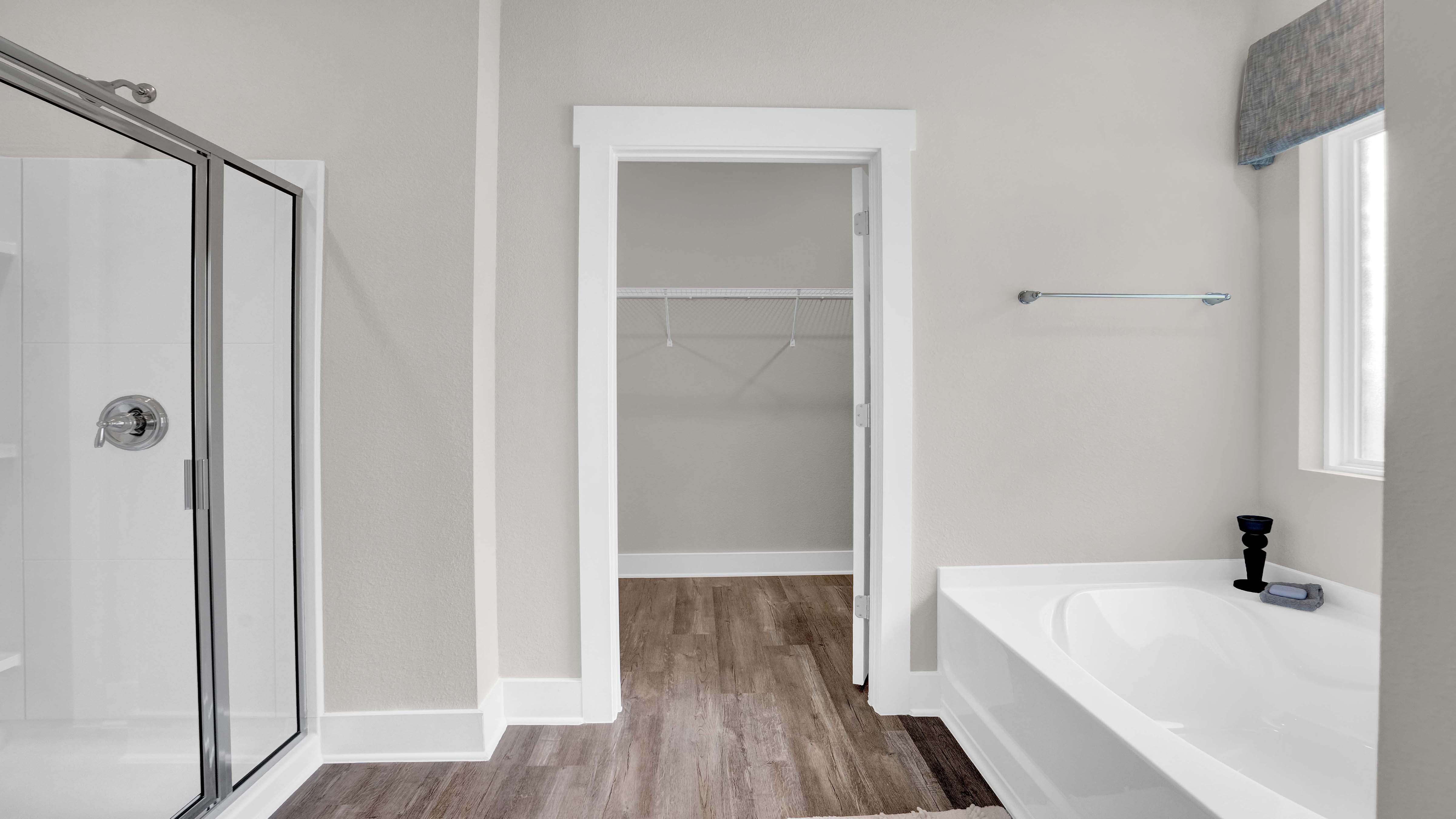 Beautiful bath with soaker tub and separate shower in Crane Landing, a new home community in Vancleave, MS.