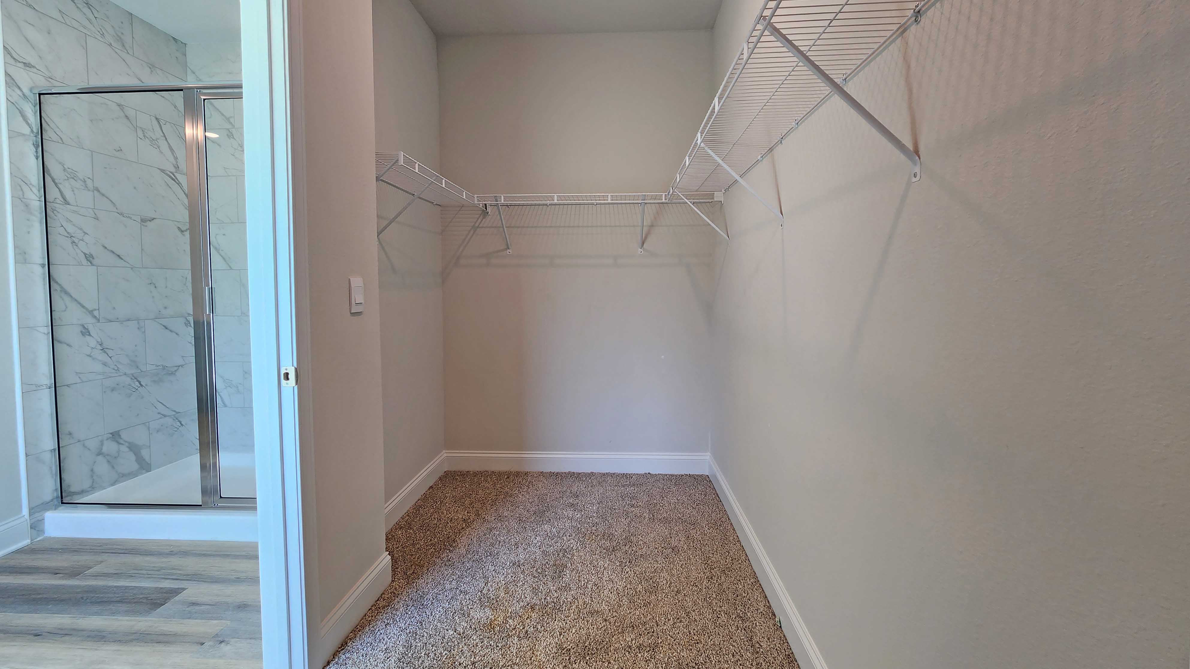 The Destin primary walk in closet in Crane Landing.