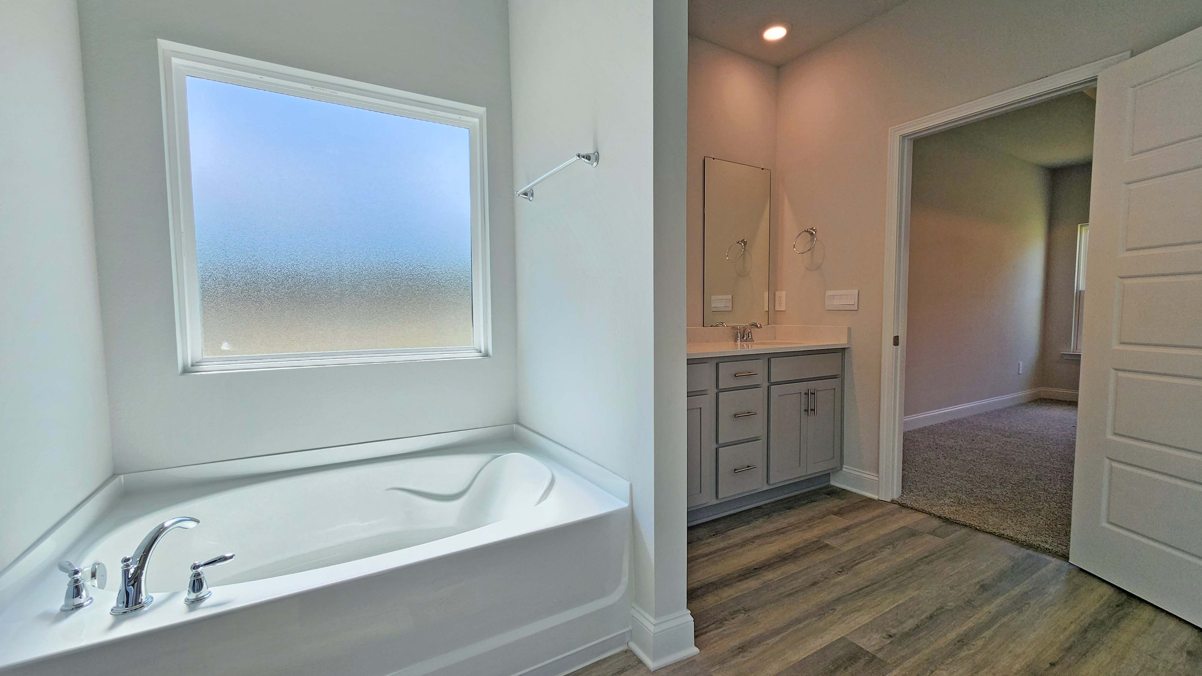 The Destin primary bath in Crane Landing.