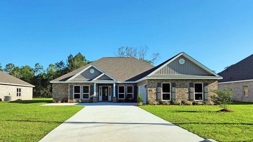 Brick home with two car garage.