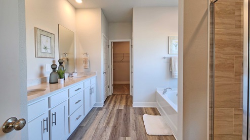 Primary bathroom with dual vanity.