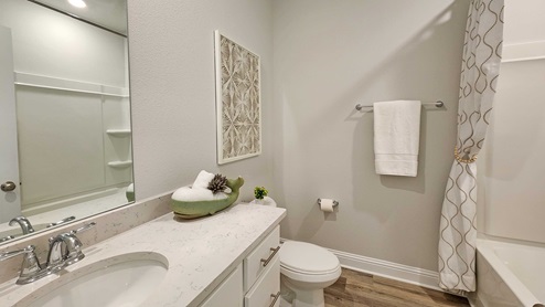 Guest bathroom with shower/tub combination.
