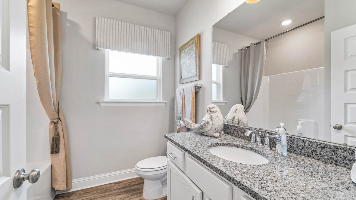 Guest bathroom with soft lighting and high-end fixtures in Sumrall.