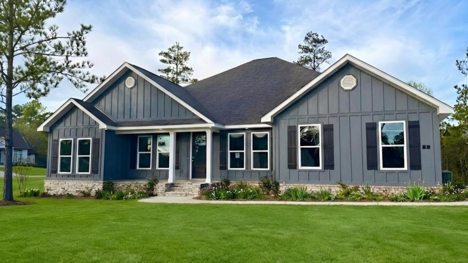 Exterior home with green grass.