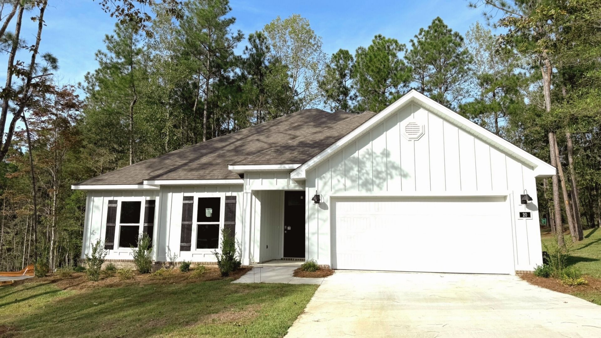 Front exterior of home with two car garage.