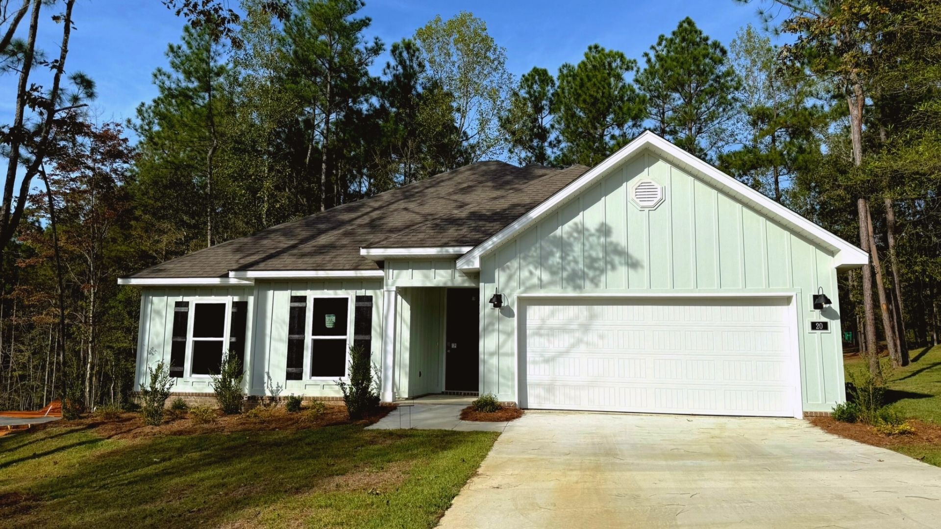 Front exterior of home with two car garage.