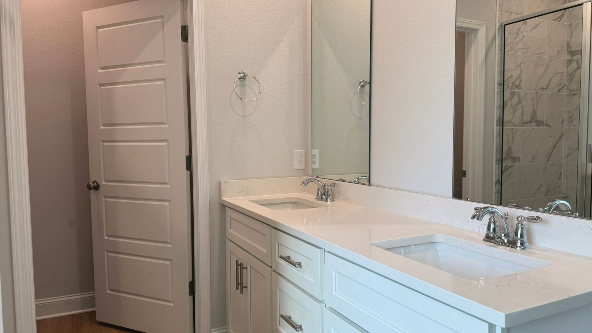 Bathroom with dual vanity sinks.
