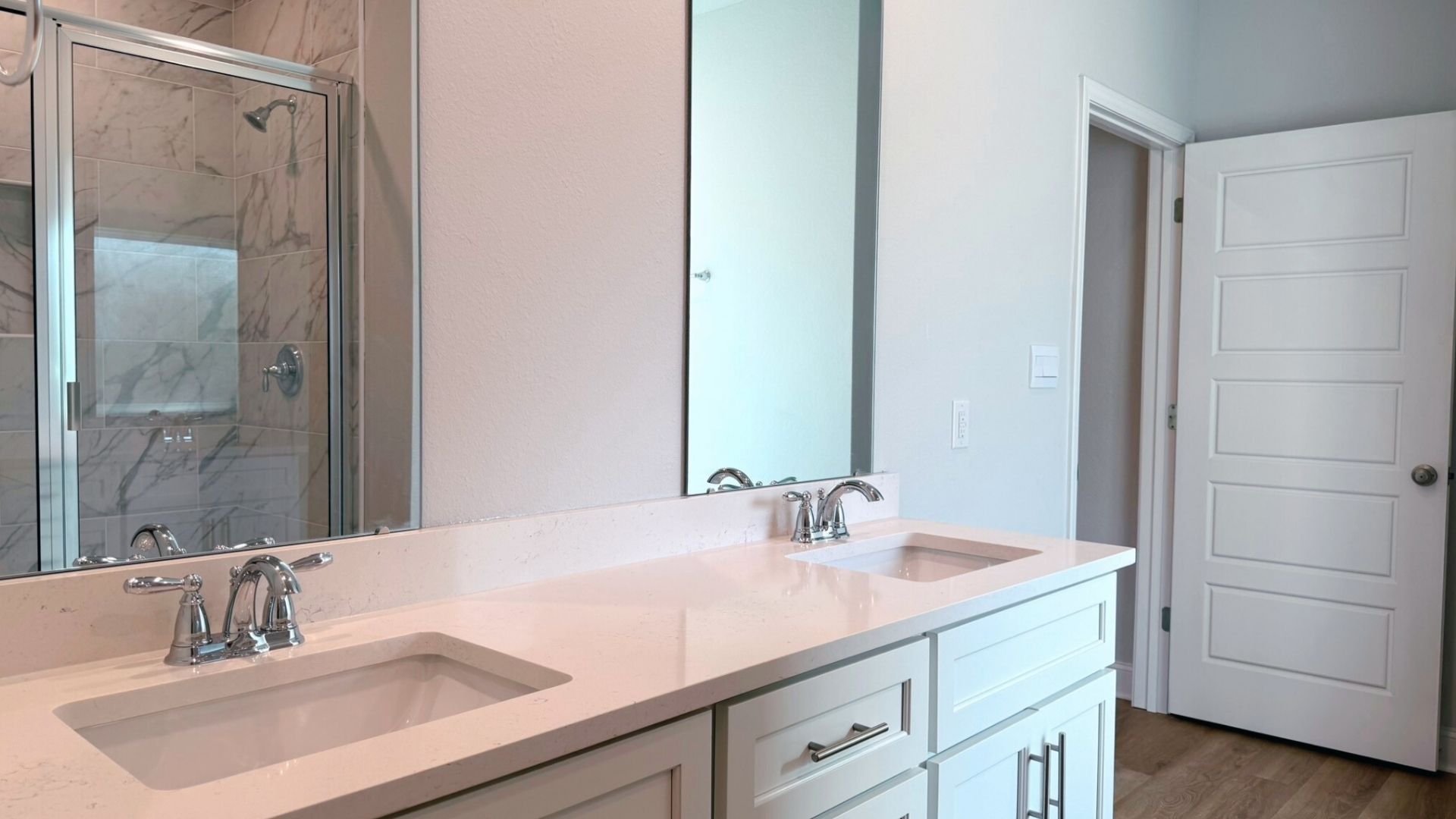 Bathroom with dual vanity sinks.