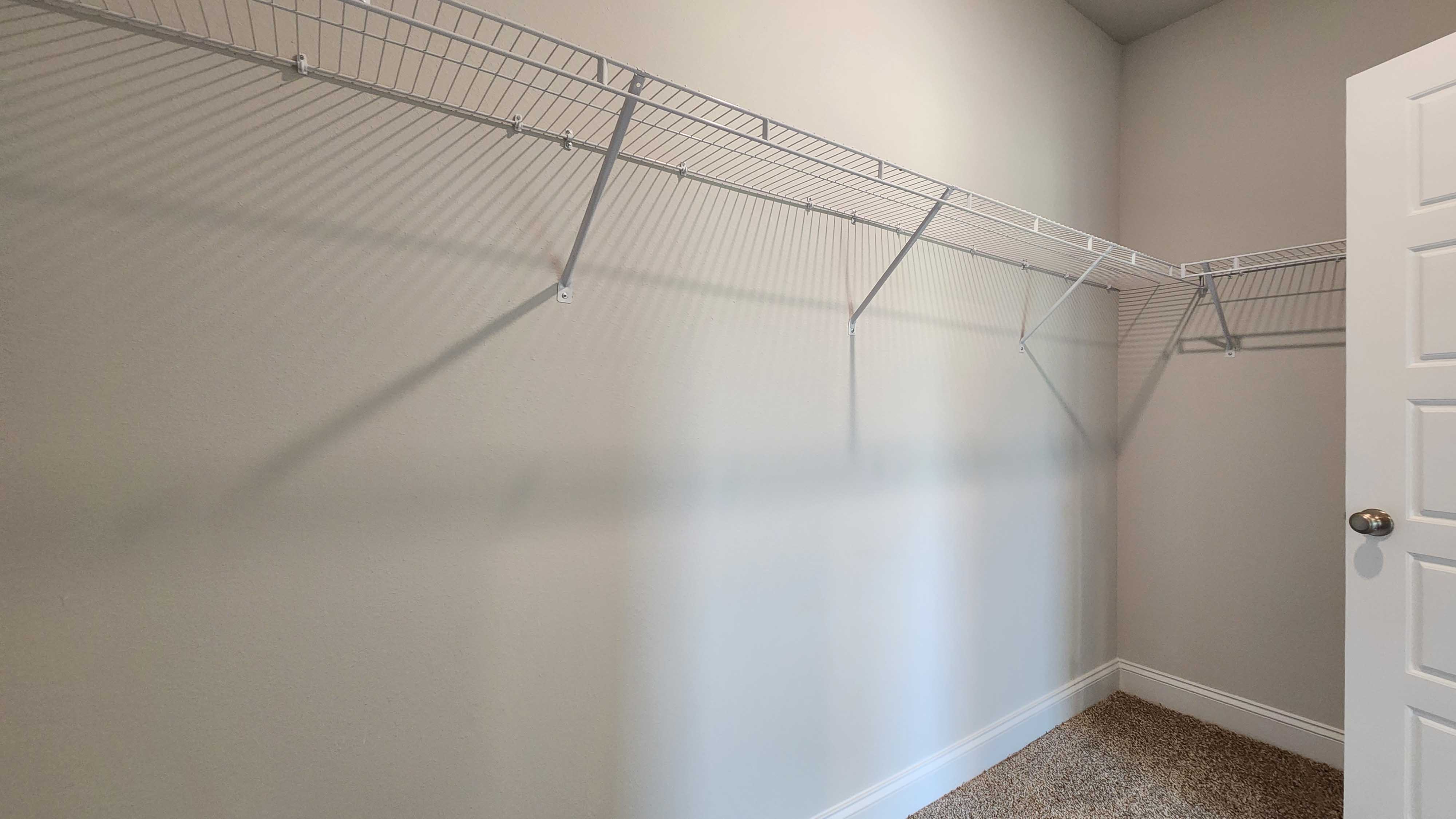 The Holly primary walk-in closet in Stonebridge.