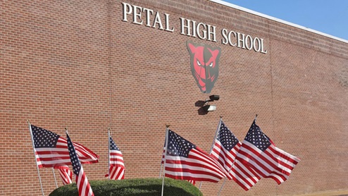 Petal High School brick building with silver letters sign