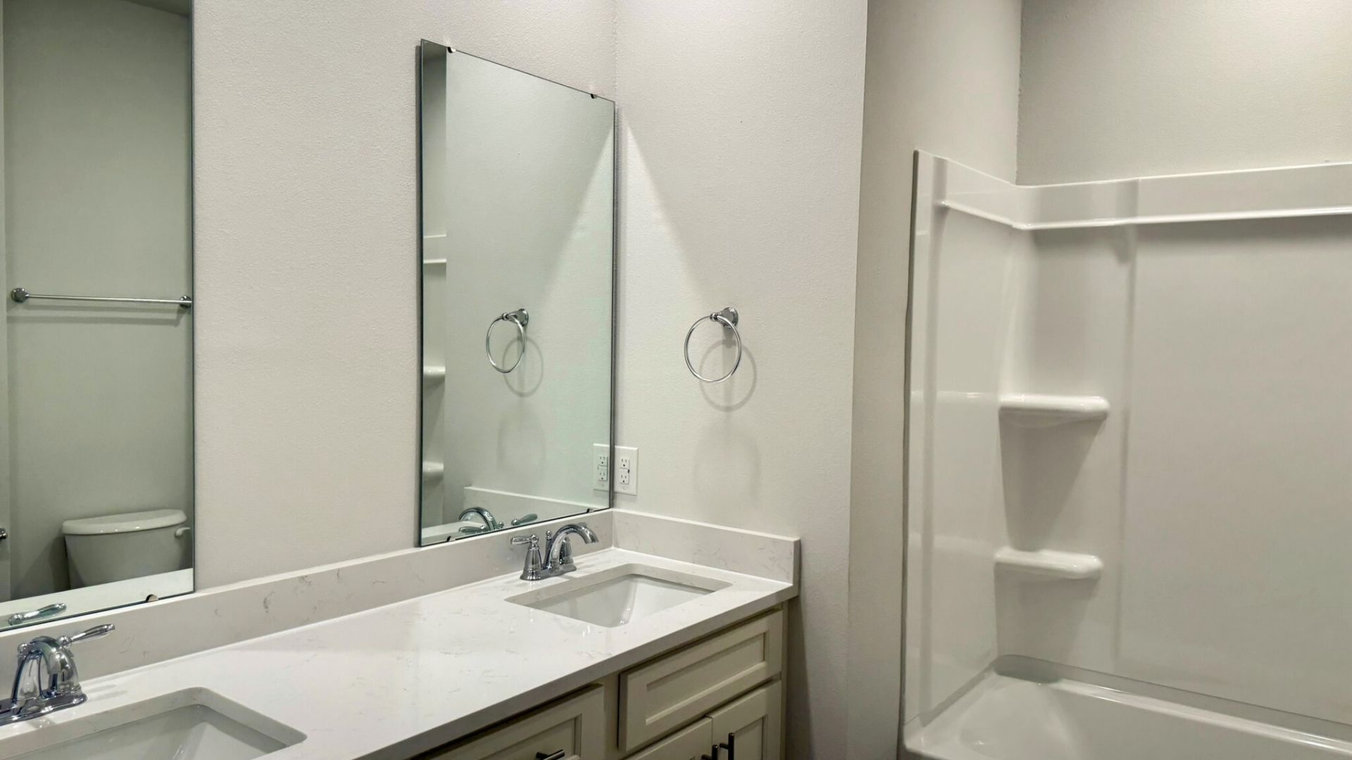 Bathroom with dual vanity sinks.