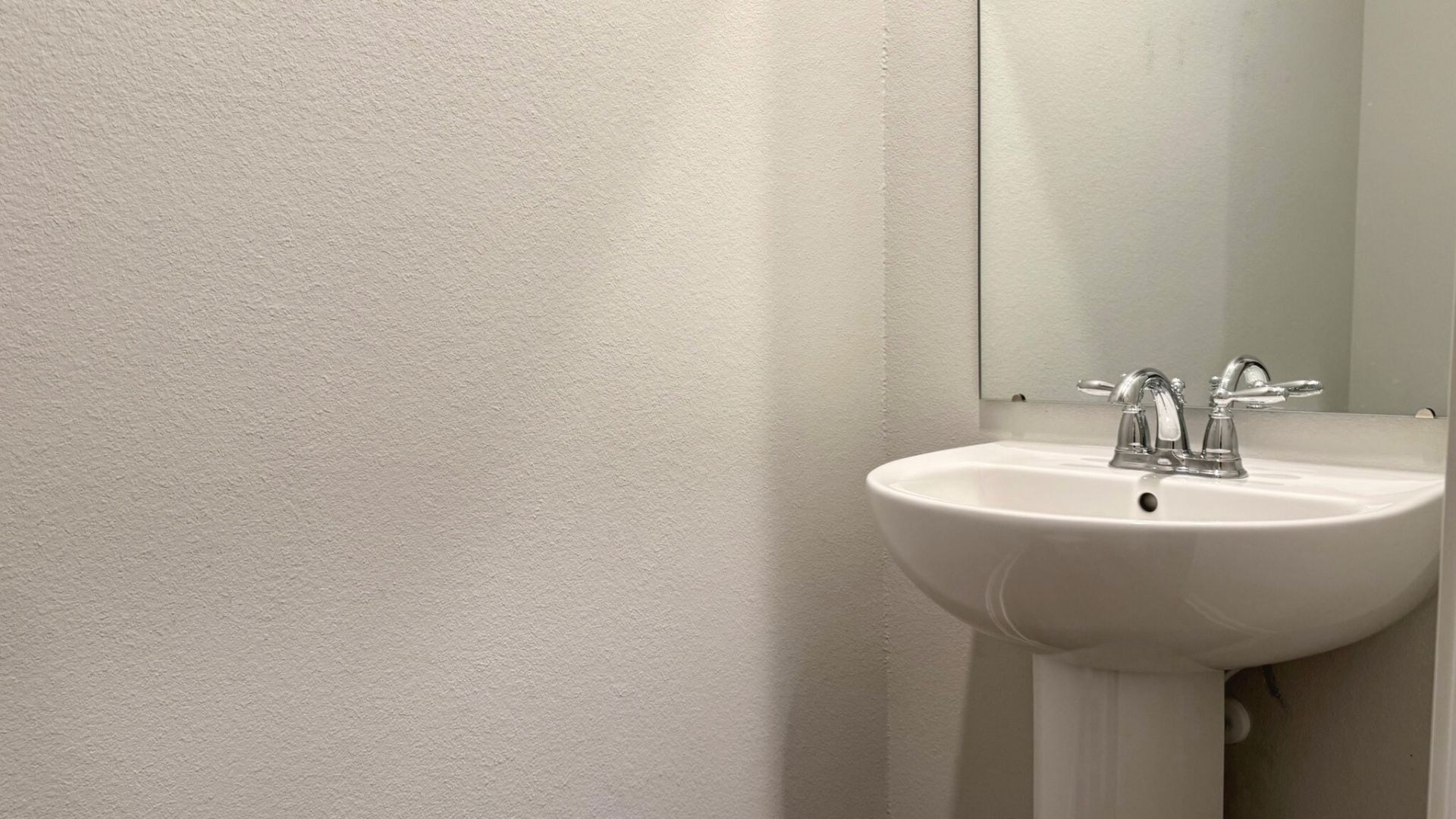 Half bathroom with a sink.