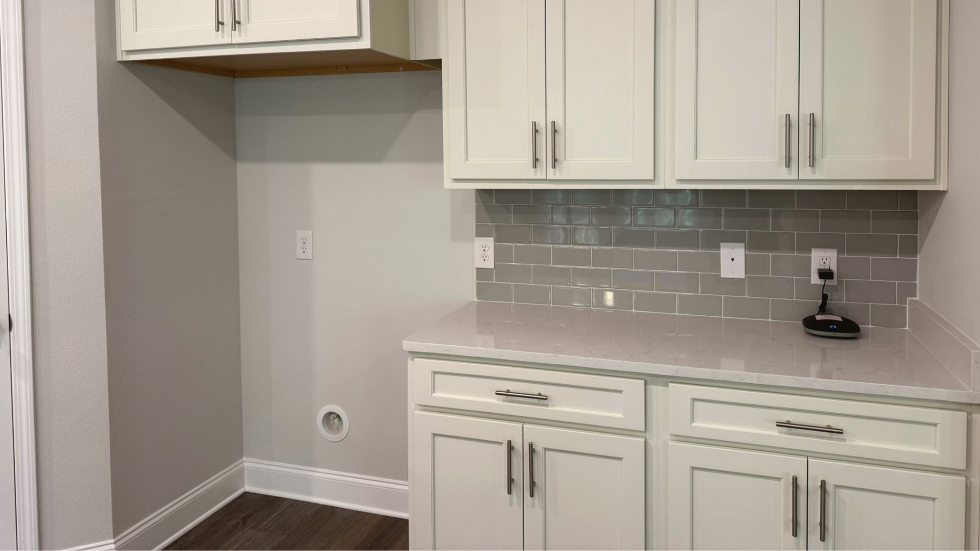 Kitchen with white cabinetry.