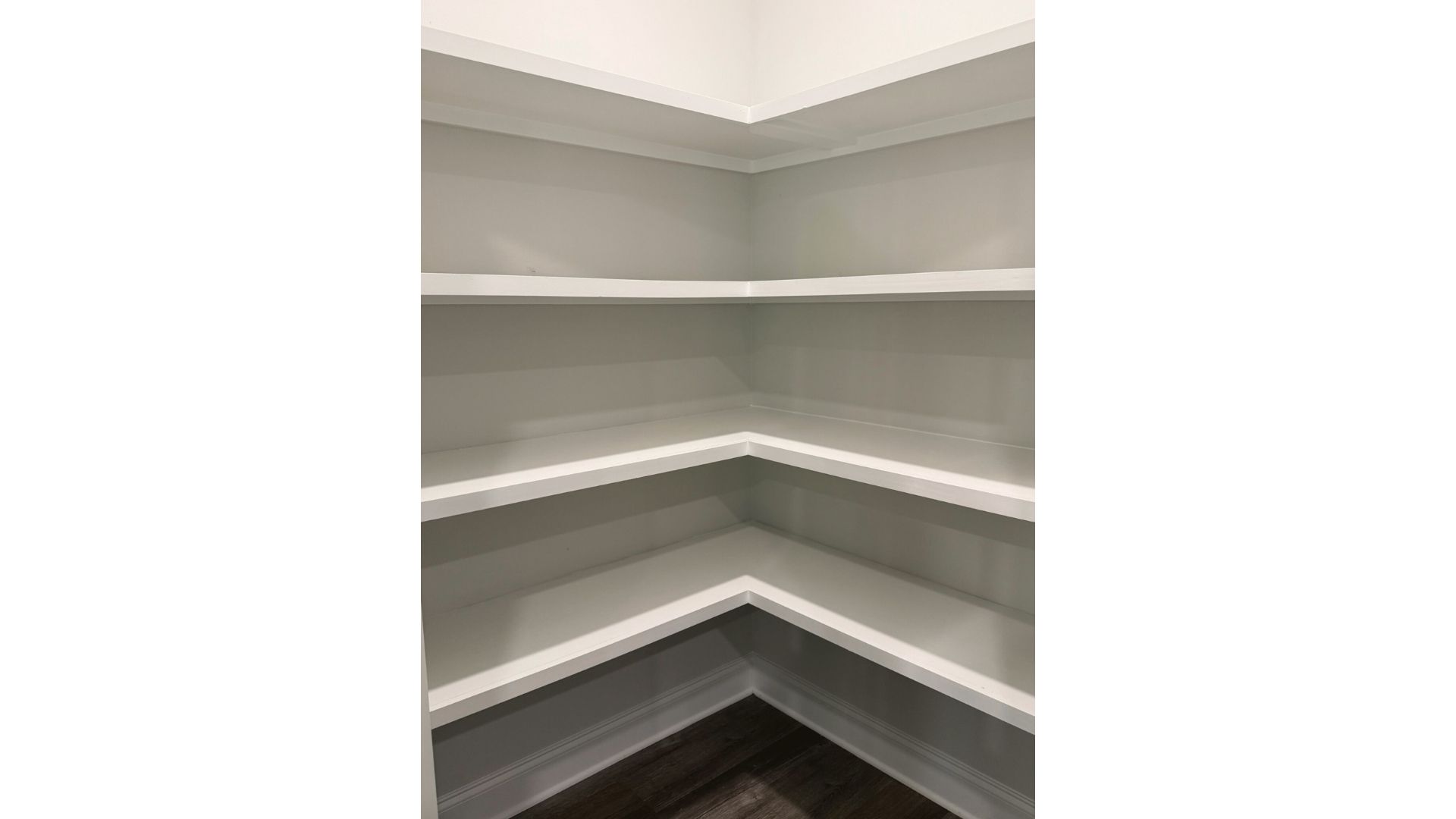 Spacious pantry with shelving.