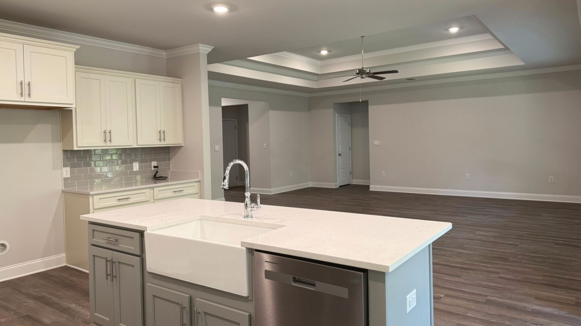 Kitchen with open view of living room.