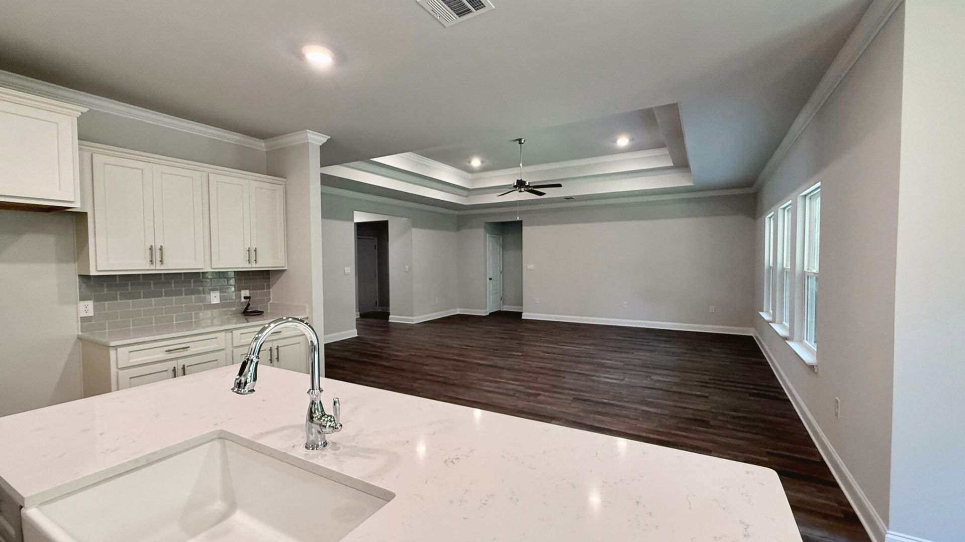 Kitchen with open view of living room.