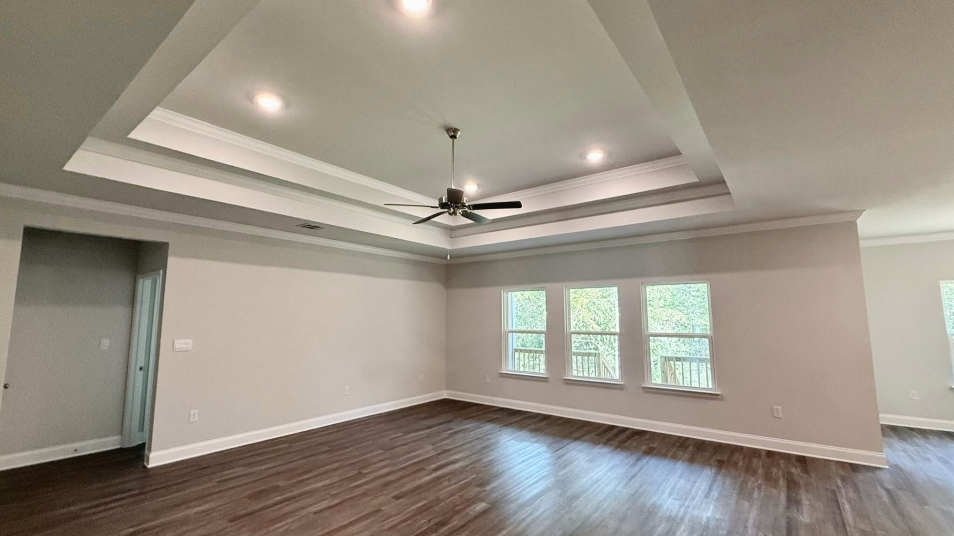 Open concept living room with large windows.