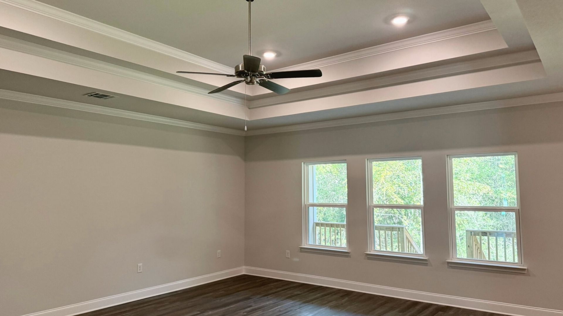 Open concept living room with large windows.