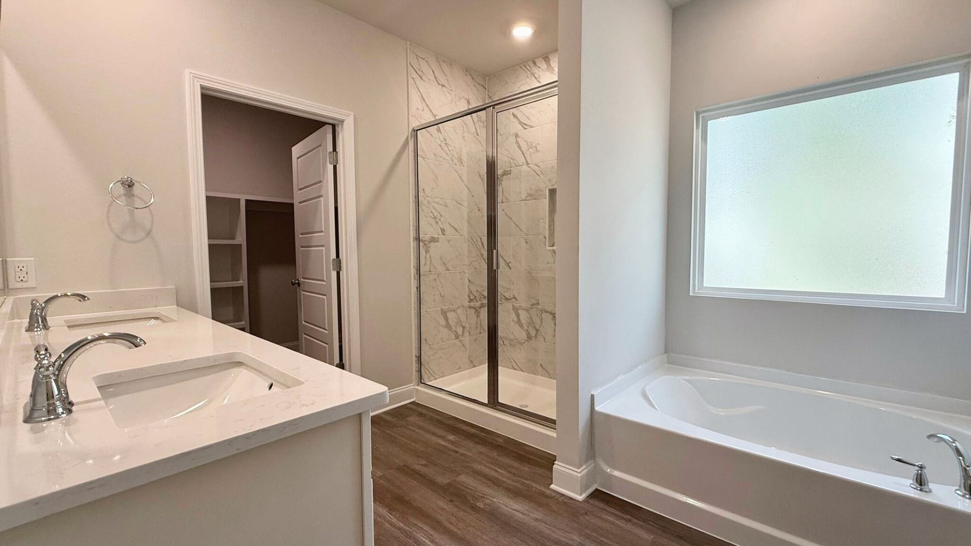 Bathroom with a bathtub and a walk in shower.