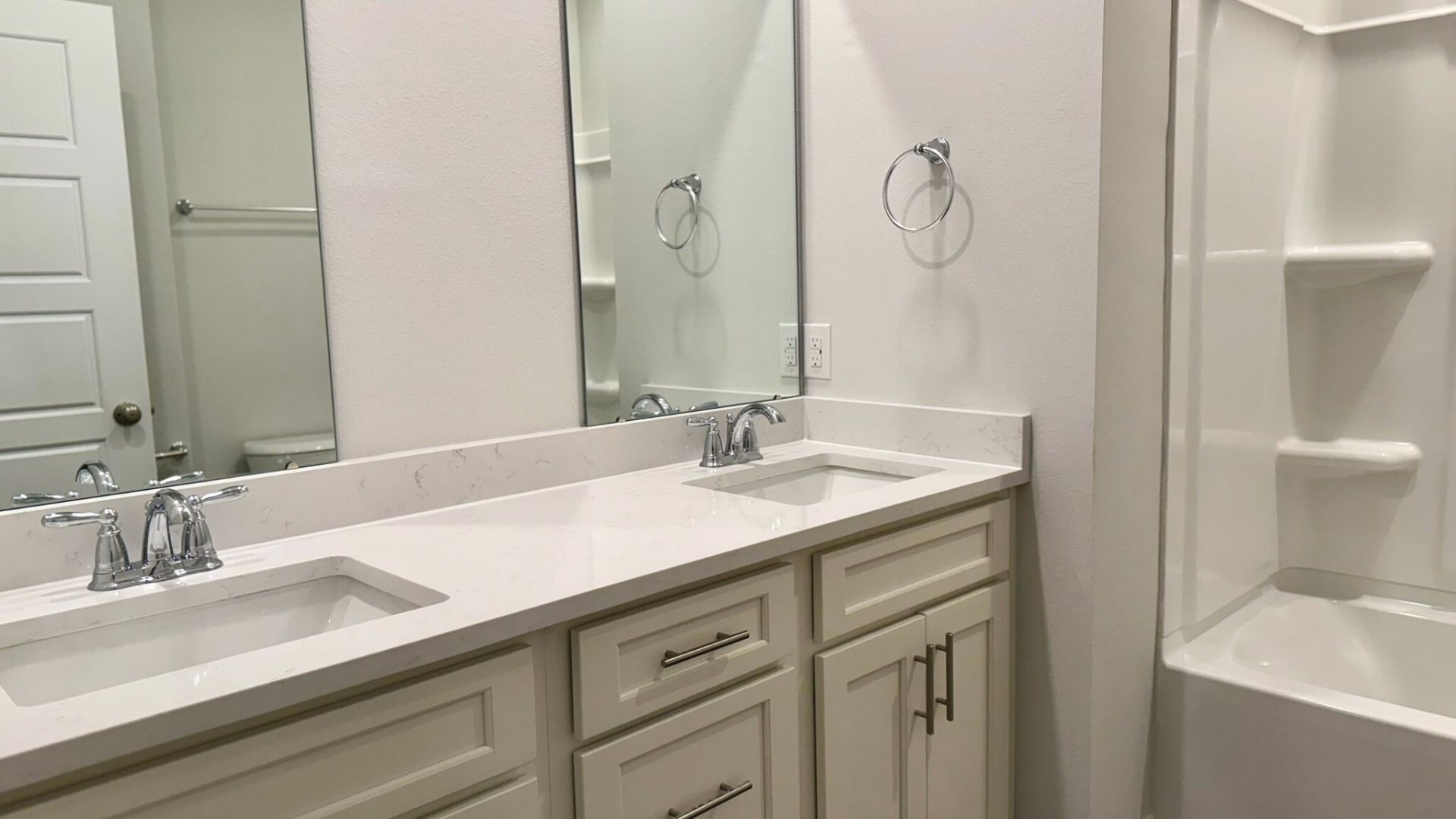 Bathroom with dual vanity sinks.