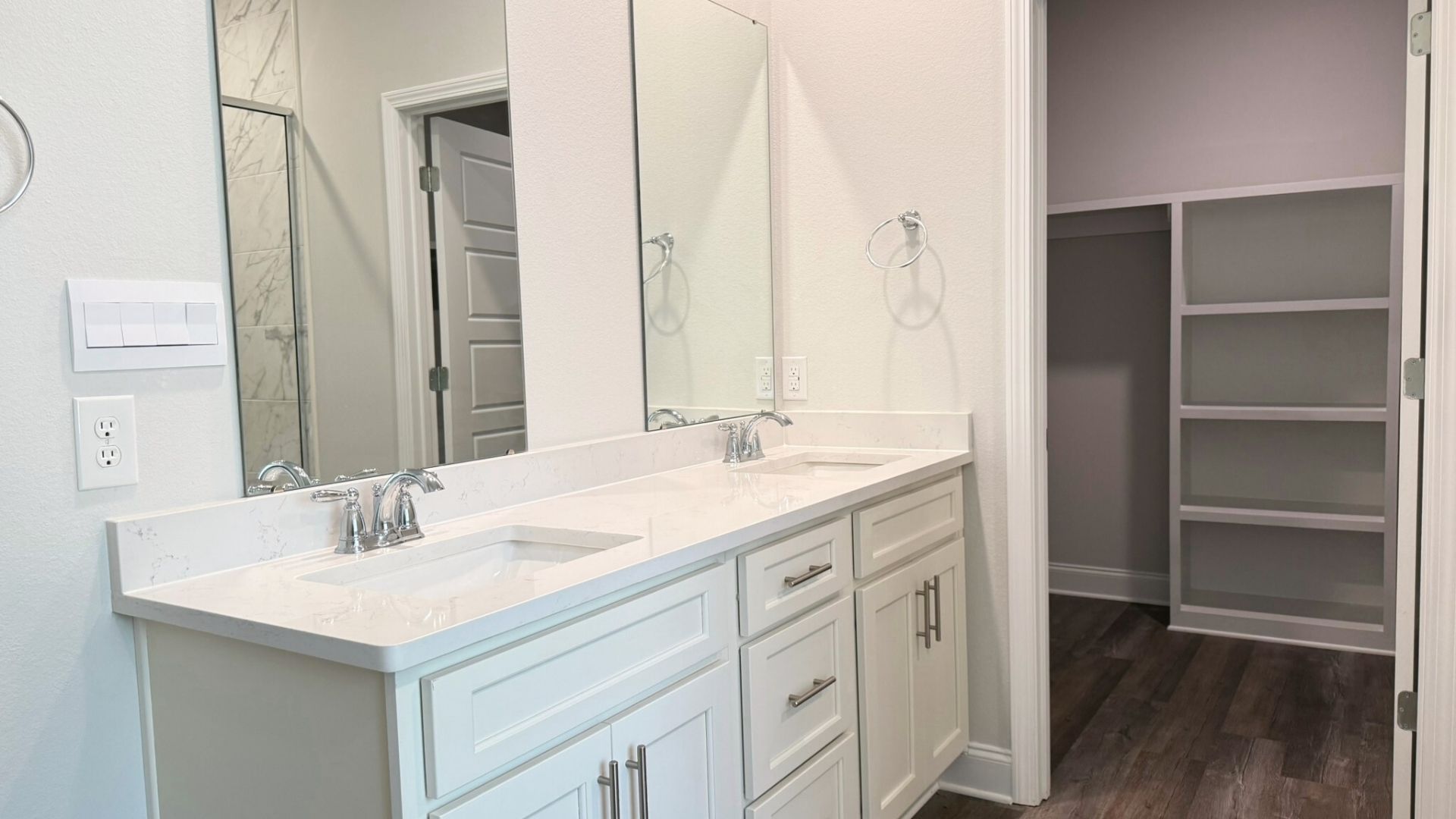 Bathroom with dual vanity sinks.