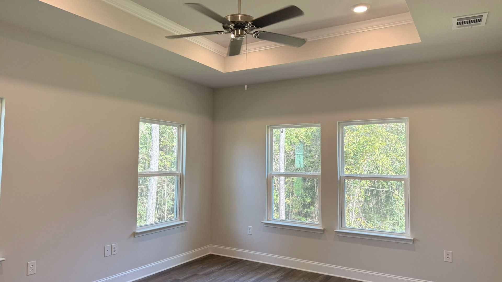 Living room with windows for natural lighting.