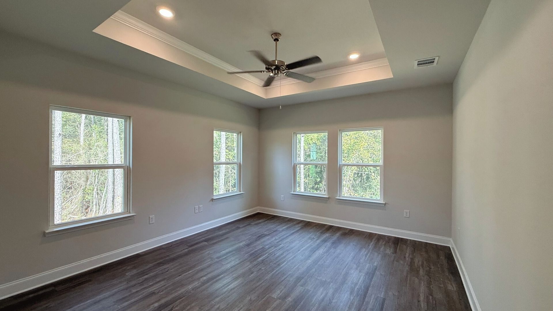 Living room with windows for natural lighting.