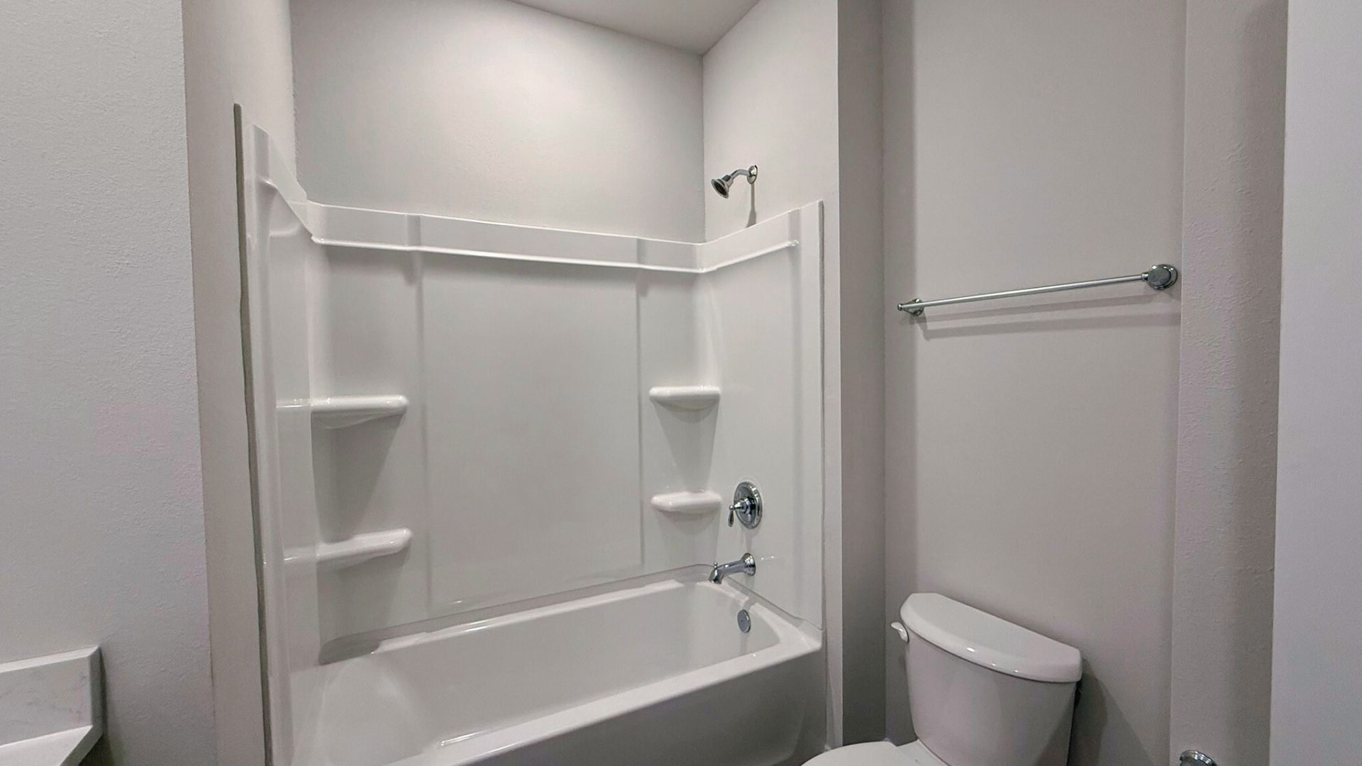 Bathroom with a step in shower.