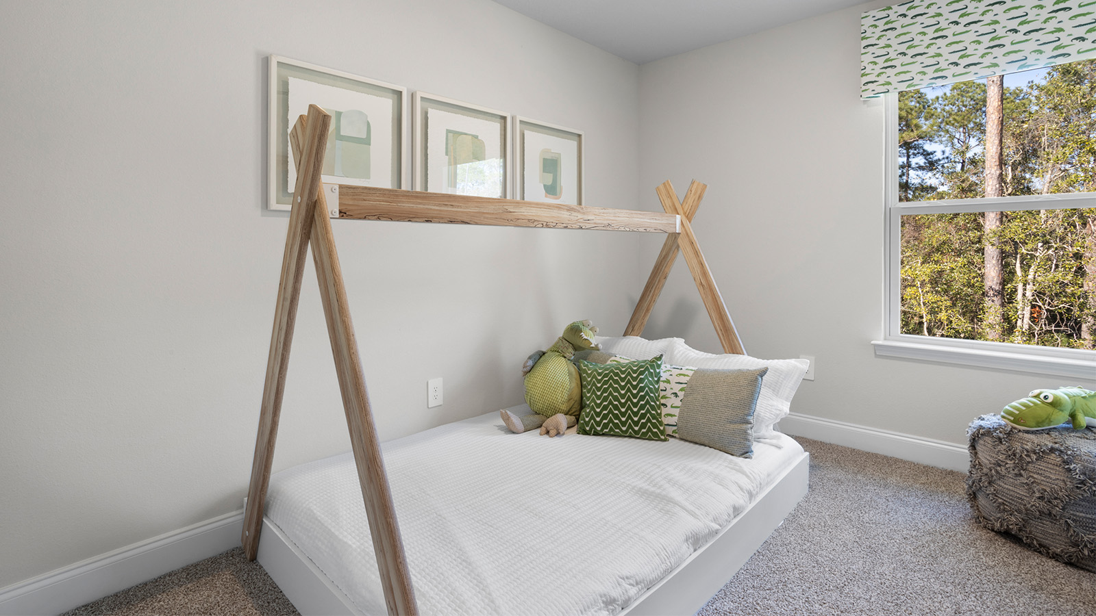 Guest bedroom with plush carpet and window for natural light.