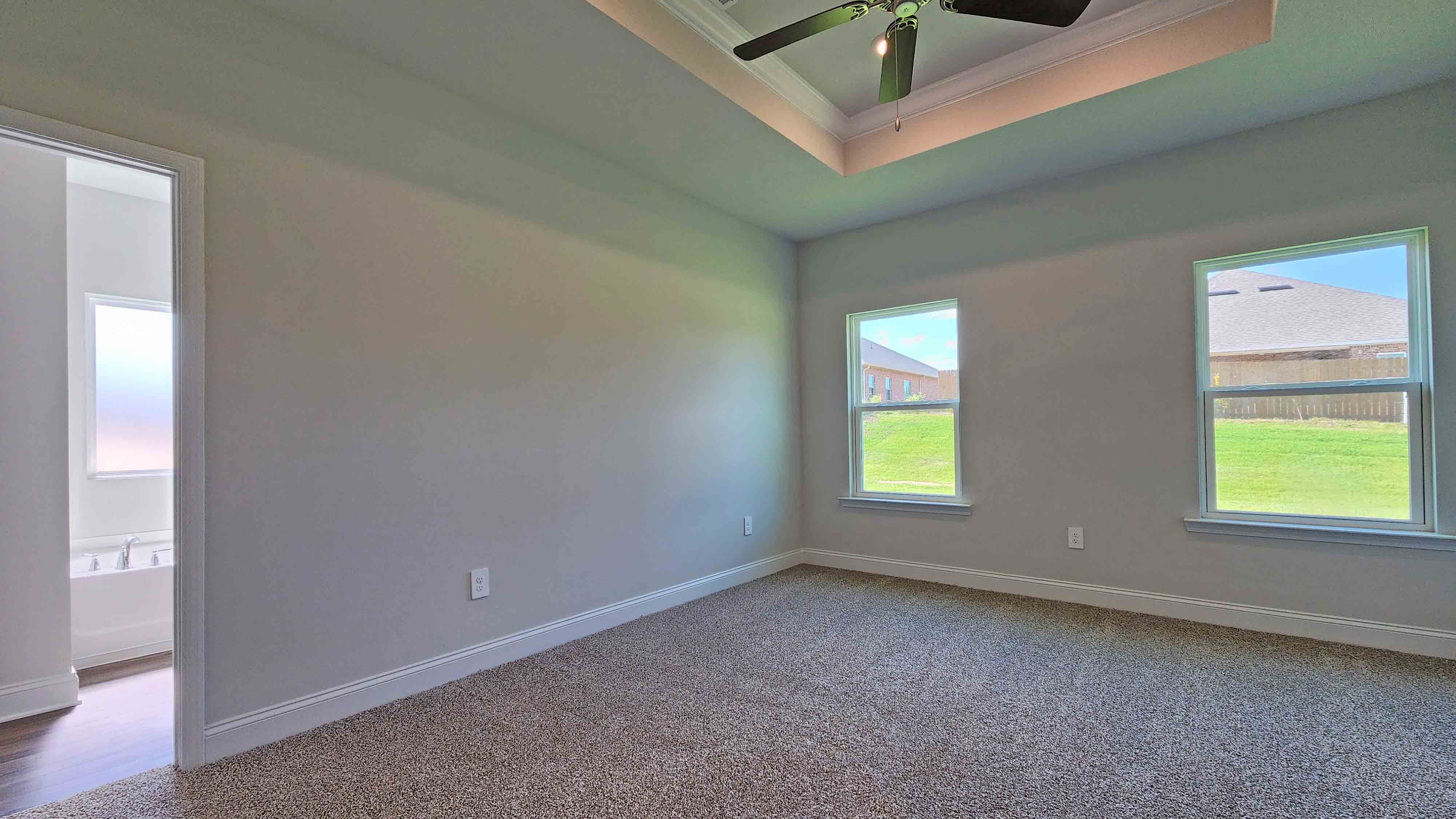 Peaceful primary retreat in the Holly with a spacious layout and private ensuite bath.