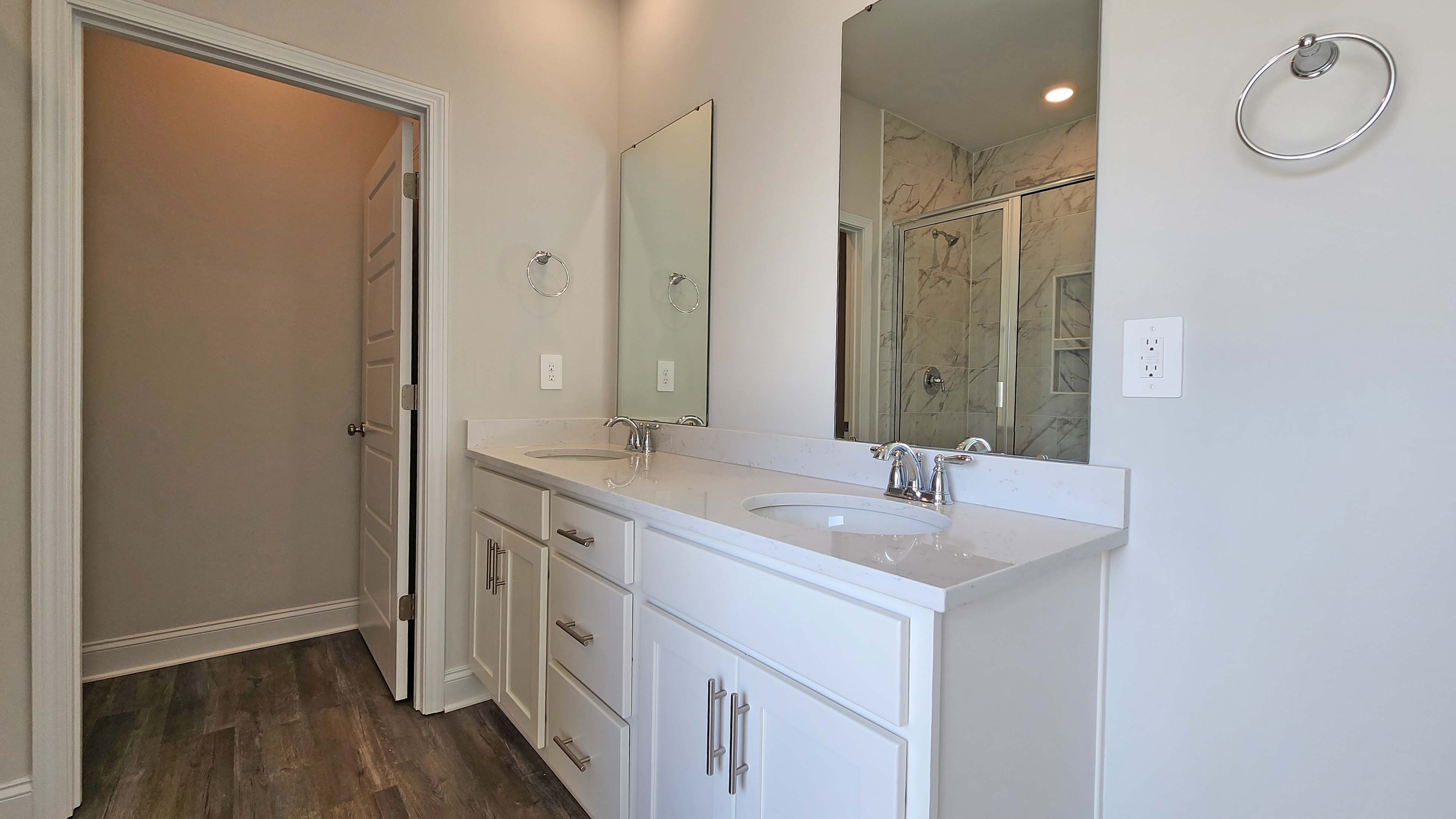 Elegant D.R. Horton primary bath with sleek features.