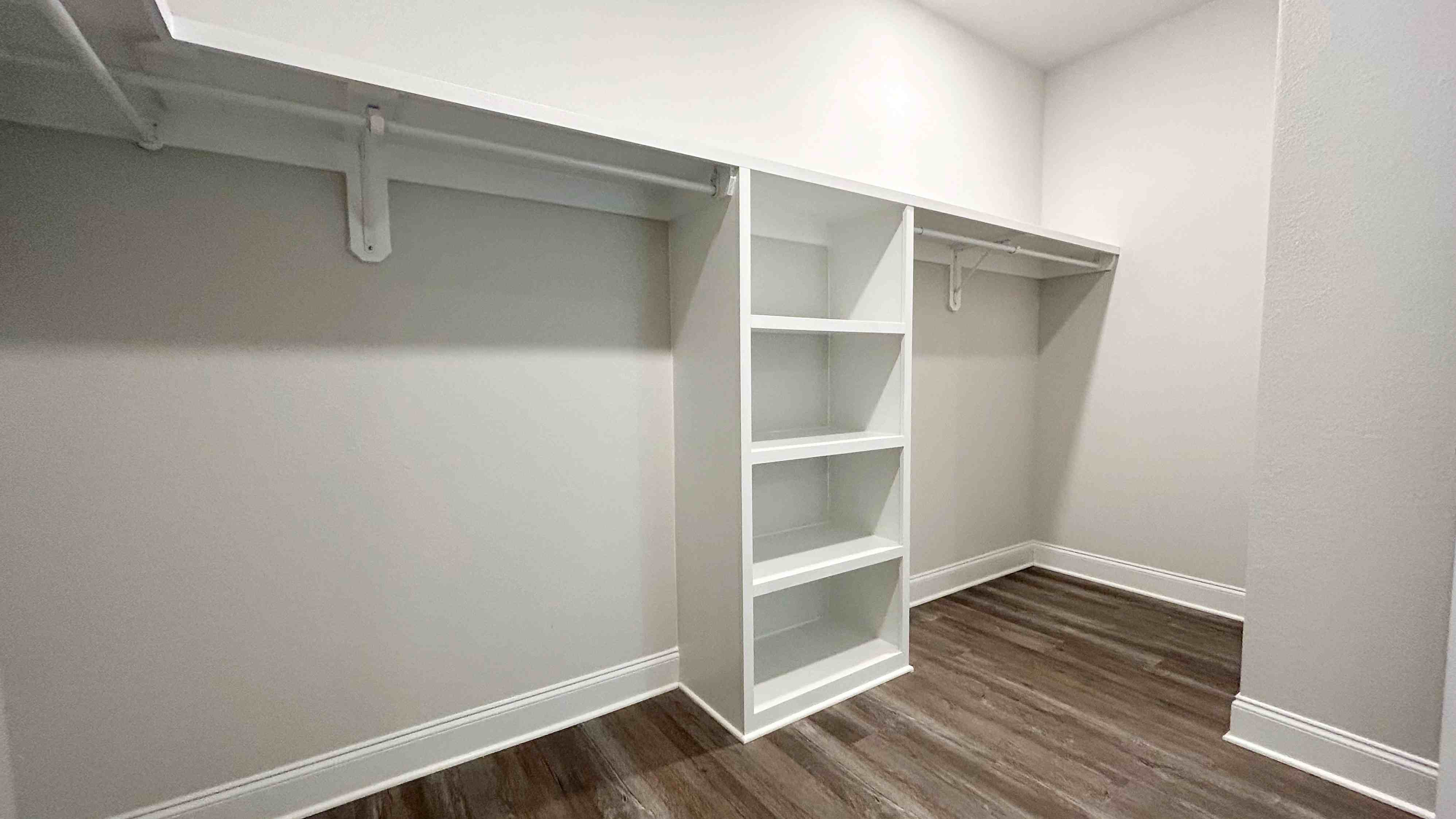 The Jasmine primary walk-in closet at Castlewoods.