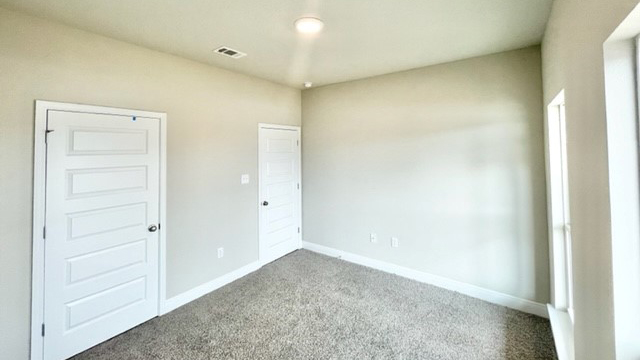 The Lamar guest bedroom in Castlewoods.