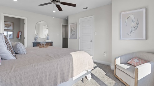 Spacious primary bedroom inside the Palm plan