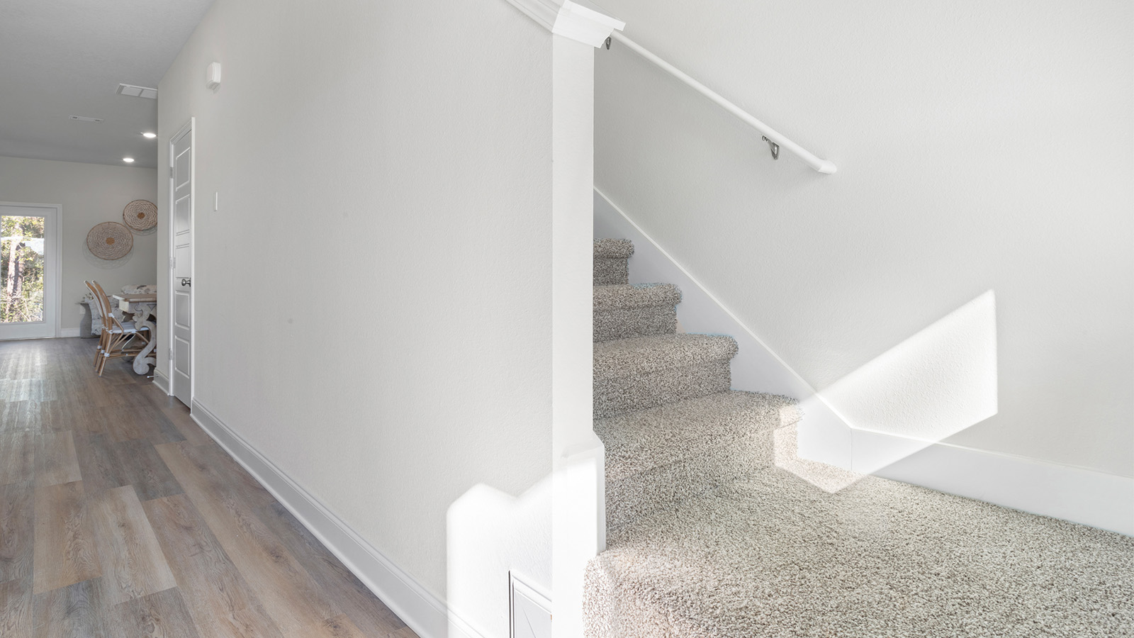 A lower stair view shows the entry design of a new home on the Mississippi Gulf Coast.