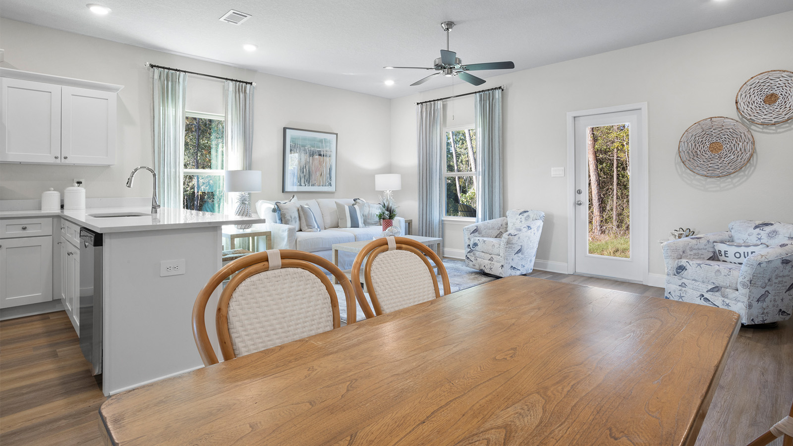 A wooden table under recessed lighting sits in a charming Harper Grove townhome.