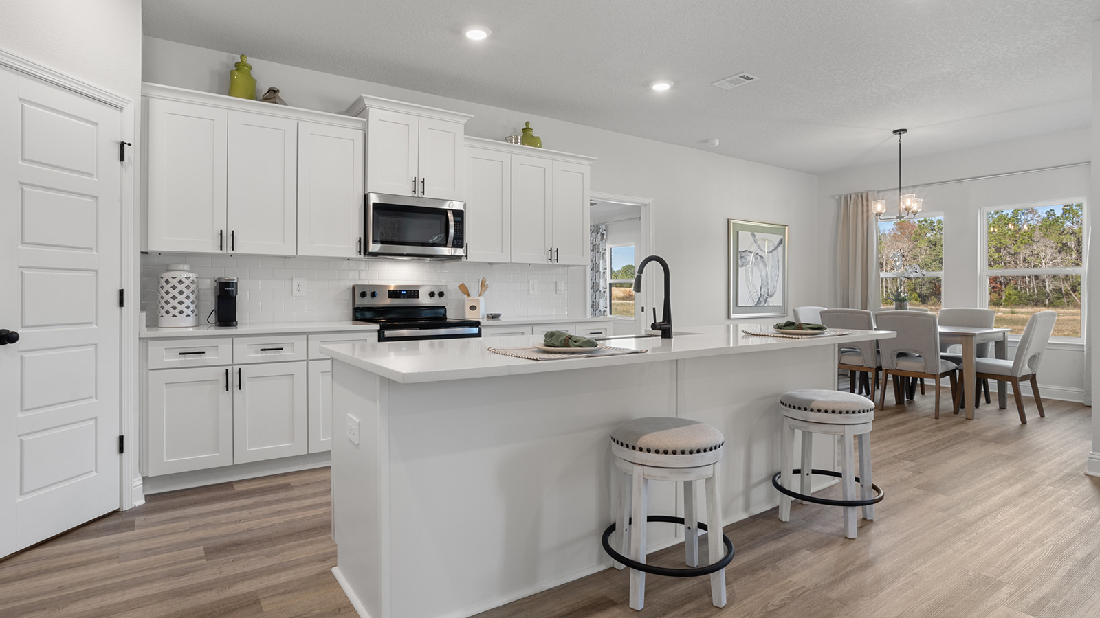 Spacious kitchen with luxurious quartz counter tops.