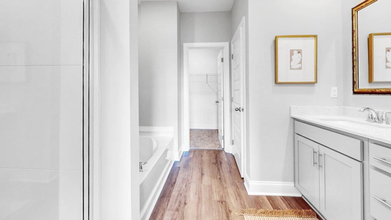 Spacious owner’s retreat with double vanity and walk in shower and closet