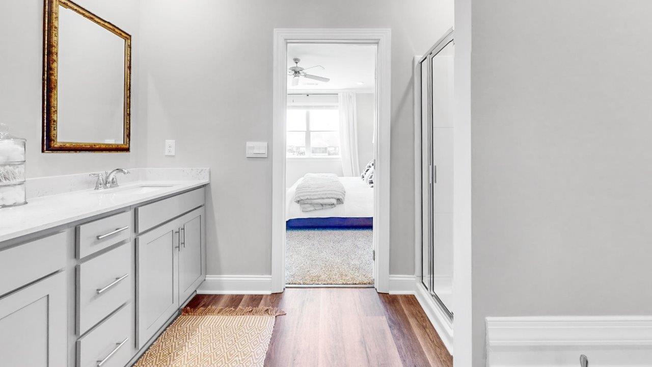 Spacious owner’s retreat with double vanity and walk in shower and closet