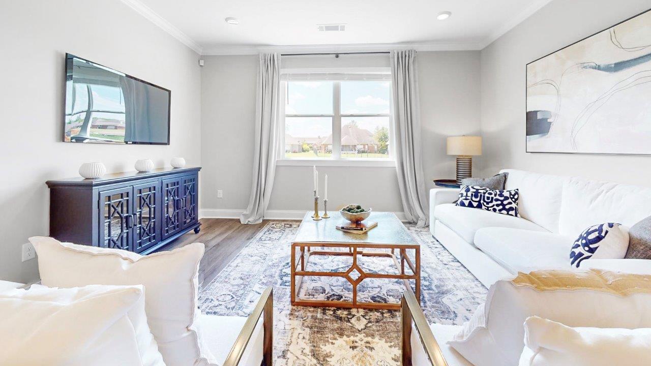 Open family room with abundant natural light and LVP throughout