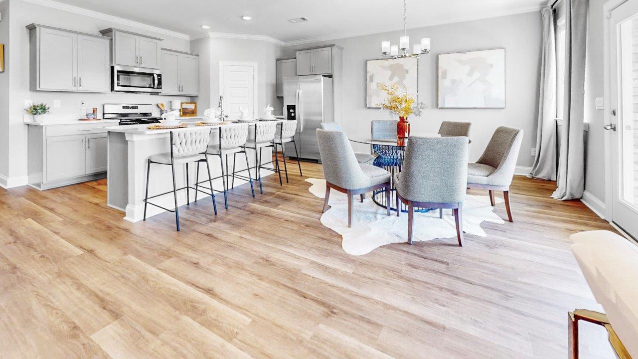 Open family room with abundant natural light and LVP throughout