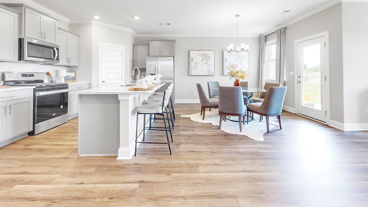 Stylish kitchen with stainless steel appliances and large island