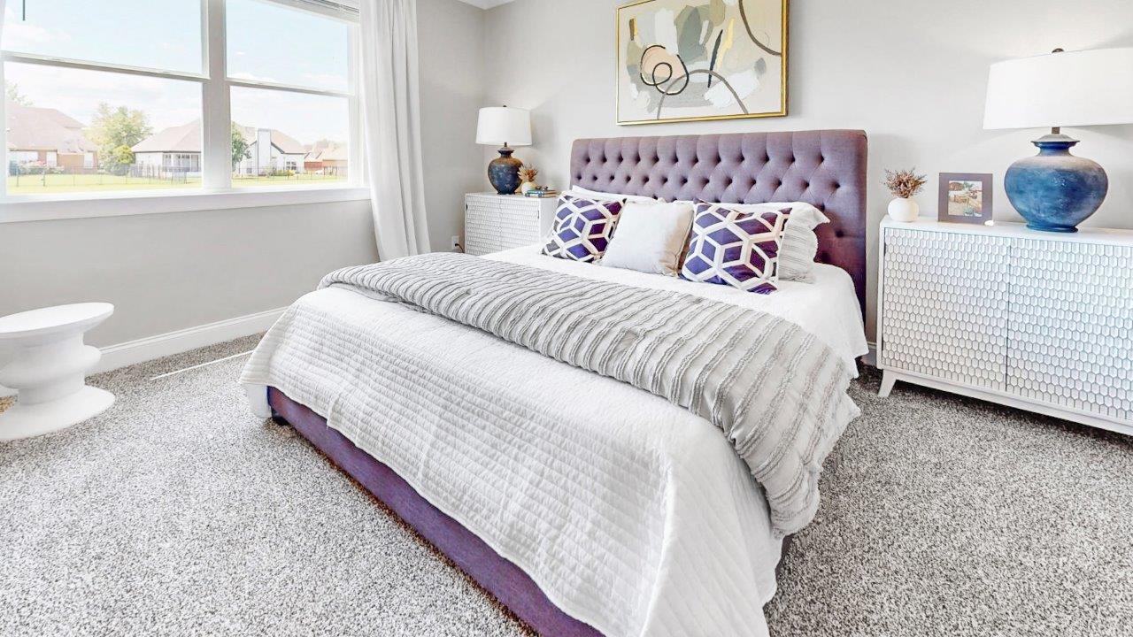 Large primary suite with walk in closet and private bath