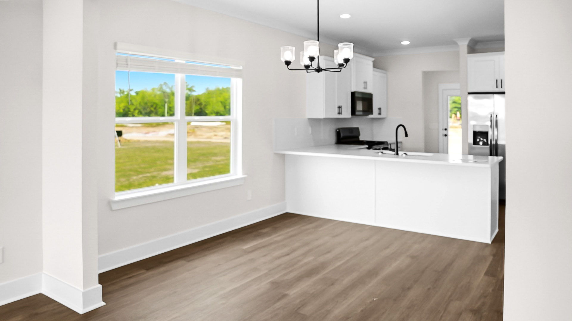 The Jackson floorplan with 9ft. ceilings, LVP flooring, and quartz countertops.
