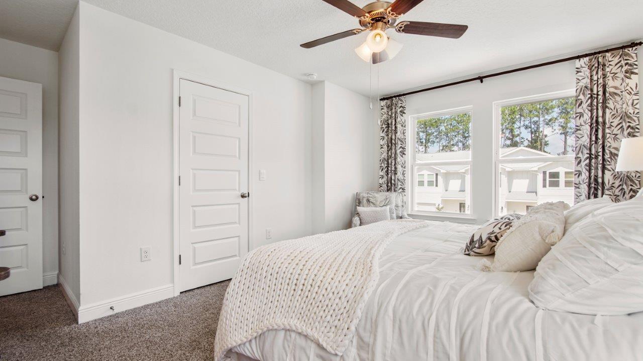 Comfortable primary suite with a quiet atmosphere and cozy carpet flooring.