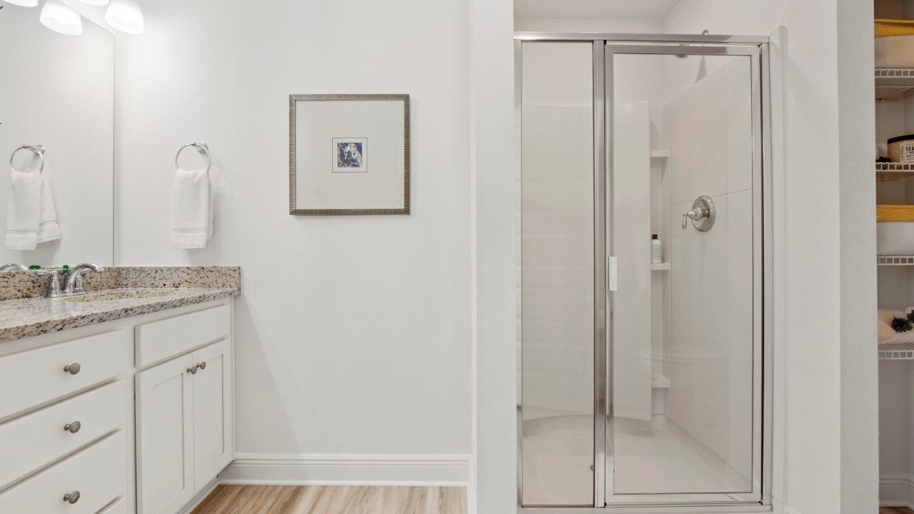 Functional full bath offering a tub/shower combo and easy to maintain surfaces.